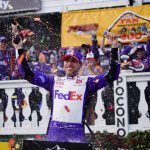 
              Denny Hamlin (11) celebrates after winning the NASCAR Cup Series auto race at Pocono Raceway, Sunday, July 24, 2022, in Long Pond, Pa. (AP Photo/Matt Slocum)
            