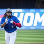 
              Toronto Blue Jays first baseman Vladimir Guerrero Jr. (27) celebrates after hitting a two-run home run during the first inning of a baseball game against the TSt. Louis Cardinals, Tuesday, July 26, 2022 in Toronto. (Christopher Katsarov/The Canadian Press via AP)
            