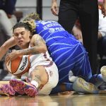 
              Connecticut Sun guard Natisha Hiedeman, left, battles Chicago Sky guard Courtney Vandersloot, right, for the ball during a WNBA basketball game in Uncasville, Conn., Sunday, July 31, 2022. (Sean D. Elliot/The Day via AP)
            
