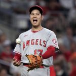 
              Los Angeles Angels starting pitcher Shohei Ohtani reacts after giving up a home run to Atlanta Braves' Austin Riley during the seventh inning of a baseball game Friday, July 22, 2022, in Atlanta. (AP Photo/Butch Dill)
            