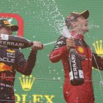 
              Ferrari driver Charles Leclerc, right, of Monaco, celebrates on the podium with second placed Red Bull driver Max Verstappen, of the Netherlands, after winning the Austrian F1 Grand Prix at the Red Bull Ring racetrack in Spielberg, Austria, Sunday, July 10, 2022. (AP Photo/Matthias Schrader)
            
