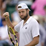 
              Jack Sock of the US celebrates beating Maxime Cressy of the US in their men's second round singles match on day five of the Wimbledon tennis championships in London, Friday, July 1, 2022. (AP Photo/Kirsty Wigglesworth)
            