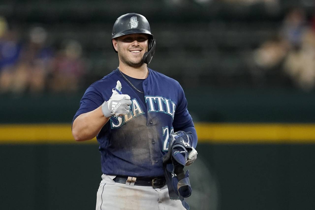 Seattle Mariners' Ty France celebrates his double in the ninth inning of a baseball game against th...