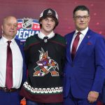 
              CORRECTS TO LOGAN COOLEY, INSTEAD OF SHANE WRIGHT - Logan Cooley poses for photos after being selected by the Arizona Coyotes with the third pick in the first round of the NHL hockey draft in Montreal on Thursday, July 7, 2022. (Ryan Remiorz/The Canadian Press via AP)
            