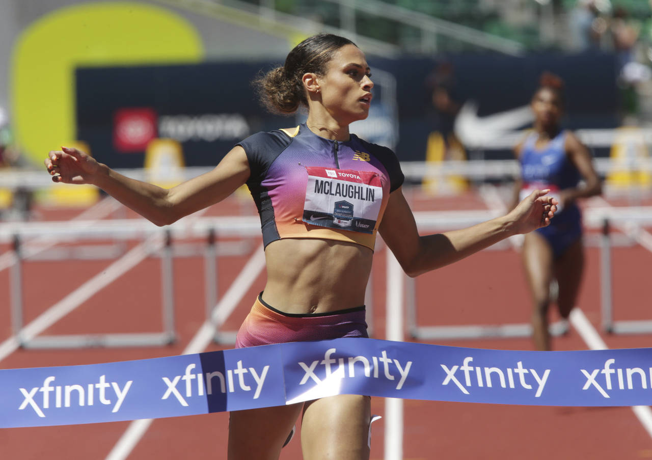 FILE - Sydney McLaughlin crosses the finish line to set a new world record in the women's 400 meter...