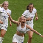 
              England's Chloe Kelly, centre, celebrates with Lauren Hemp, left, and Jill Scott after scoring her side's second goal during the Women's Euro 2022 final soccer match between England and Germany at Wembley stadium in London, Sunday, July 31, 2022. (AP Photo/Rui Vieira)
            