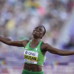 
              Tobi Amusan, of Nigeria, wins the women's 100-meter hurdles final at the World Athletics Championships on Sunday, July 24, 2022, in Eugene, Ore. (AP Photo/Ashley Landis)
            