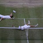 
              Matthew Ebden, left, and Max Purcell of Australia celebrate after beating Mate Pavic and Nikola Mektic of Croatia to win the final of the men's doubles on day thirteen of the Wimbledon tennis championships in London, Saturday, July 9, 2022. (AP Photo/Alastair Grant)
            