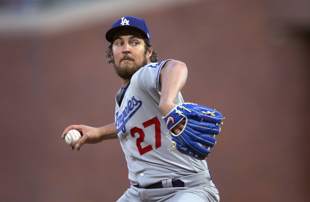 FILE - Los Angeles Dodgers starting pitcher Trevor Bauer works against the San Francisco Giants dur...