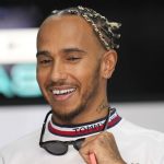 
              Mercedes driver Lewis Hamilton, of Britain, smiles at pit prior to the start of the first practice for the French Formula One Grand Prix at Paul Ricard racetrack in Le Castellet, southern France, Friday, July 22, 2022. The French Grand Prix will be held on Sunday. (AP Photo/Manu Fernandez)
            