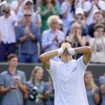 
              Chile's Cristian Garin reacts after defeating Australia's Alex De Minaur during a men's singles fourth round match on day eight of the Wimbledon tennis championships in London, Monday, July 4, 2022. (AP Photo/Kirsty Wigglesworth)
            