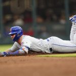 
              New York Mets' Pete Alonso slides into second base with an RB-double in the third inning of a baseball game against the Atlanta Braves, Monday, July 11, 2022, in Atlanta. (AP Photo/John Bazemore)
            