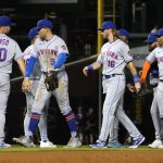 
              The New York Mets celebrate the team's 8-0 shutout of the Chicago Cubs in a baseball game Thursday, July 14, 2022, in Chicago. (AP Photo/Charles Rex Arbogast)
            
