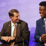 
              Clemson head coach Dabo Swinney, left, laughs with defensive end K.J. Henry at the NCAA college football Atlantic Coast Conference Media Days in Charlotte, N.C., Wednesday, July 20, 2022. (AP Photo/Nell Redmond)
            