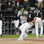 
              Chicago White Sox's Adam Engel scores on a wild pitch from Oakland Athletics relief pitcher Zach Jackson to give the White Sox a 3-2 win during during the ninth inning of a baseball game Saturday, July 30, 2022, in Chicago. (AP Photo/Charles Rex Arbogast)
            
