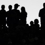 
              Fans watch during the fifth inning of a baseball game between the New York Mets and the Chicago Cubs in Chicago, Sunday, July 17, 2022. (AP Photo/Nam Y. Huh)
            