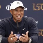 
              US golfer Tiger Woods speaks during a press conference at the British Open golf championship in St Andrews, Scotland, Tuesday, July 12, 2022. The Open Championship returns to the home of golf on July 14-17, 2022, to celebrate the 150th edition of the sport's oldest championship, which dates to 1860 and was first played at St. Andrews in 1873. (AP Photo/Peter Morrison)
            
