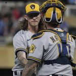 
              Milwaukee Brewers relief pitcher Josh Hader, left, and catcher Omar Narvaez celebrate after the Brewers defeated the Minnesota Twins in a baseball game Tuesday, July 12, 2022, in Minneapolis. Hader picked up the save. (AP Photo/Jim Mone)
            