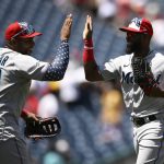 
              Miami Marlins' Bryan De La Cruz, right, and Jesus Aguilar (99) celebrate after a baseball game against the Washington Nationals, Monday, July 4, 2022, in Washington. The Marlins won 3-2 in ten innings. (AP Photo/Nick Wass)
            