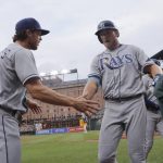 
              Tampa Bay Rays' Luke Raley, right, is greeted near the dugout by Brett Phillips after hitting a solo home run against the Baltimore Orioles during the third inning of a baseball game, Wednesday, July 27, 2022, in Baltimore. (AP Photo/Julio Cortez)
            