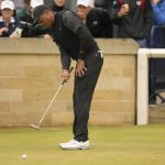 
              Tiger Woods of the US putts during a practice round at the British Open golf championship on the Old Course at St. Andrews, Scotland, Wednesday July 13, 2022. The Open Championship returns to the home of golf on July 14-17, 2022, to celebrate the 150th edition of the sport's oldest championship, which dates to 1860 and was first played at St. Andrews in 1873. (AP Photo/Gerald Herbert)
            