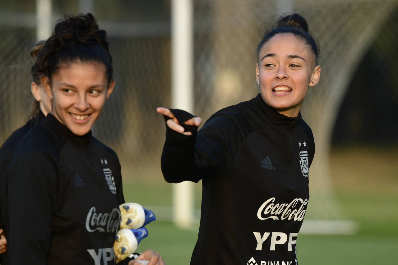 Argentina women´s national soccer team players Marina Delgado, right, points at Julieta Cruz durin...