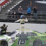 
              AJ Allmendinger celebrates after winning the NASCAR Xfinity Series auto race at Indianapolis Motor Speedway, Saturday, July 30, 2022, in Indianapolis. (AP Photo/Darron Cummings)
            