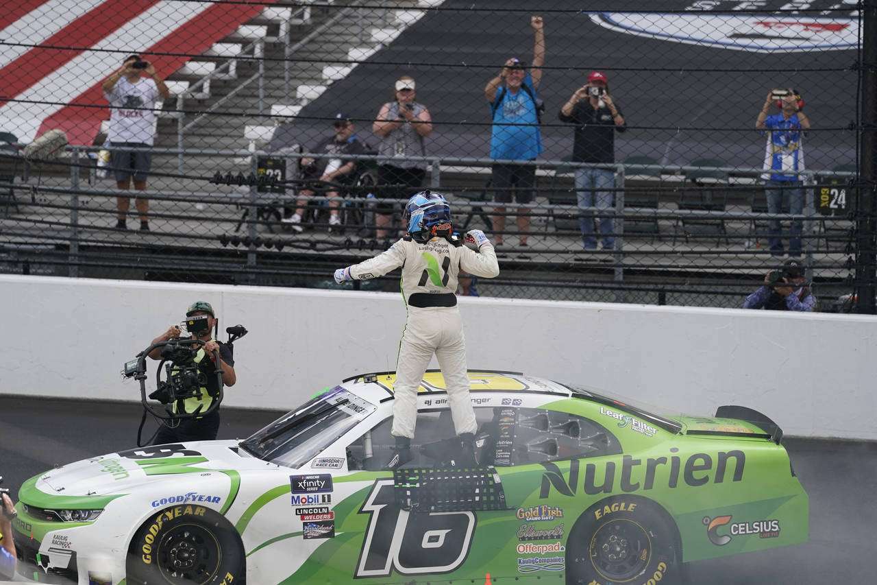 AJ Allmendinger celebrates after winning the NASCAR Xfinity Series auto race at Indianapolis Motor ...
