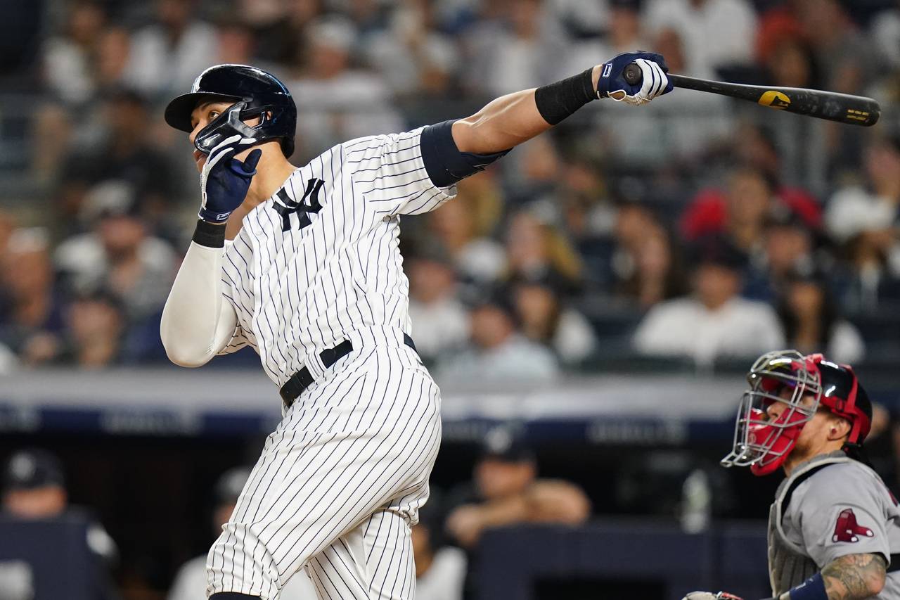 New York Yankees' Aaron Judge follows through on a home run during the fifth inning of the team's b...