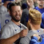 
              Los Angeles Dodgers starting pitcher Clayton Kershaw, left, hugs Justin Turner after the eighth inning of a baseball game against the Los Angeles Angels Friday, July 15, 2022, in Anaheim, Calif. (AP Photo/Mark J. Terrill)
            