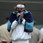
              Greece's Stefanos Tsitsipas during a break in his third round men's singles match against Australia's Nick Kyrgios on day six of the Wimbledon tennis championships in London, Saturday, July 2, 2022. (AP Photo/Kirsty Wigglesworth)
            