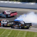 
              Todd Bodine (62) slides down the back section beside Blaine Perkins (9) and Max Gutierrez (22) during the NASCAR Truck Series Race at Pocono Raceway, Saturday, July 23, 2022 in Long Pond, Pa. (AP Photo/Matt Slocum)
            