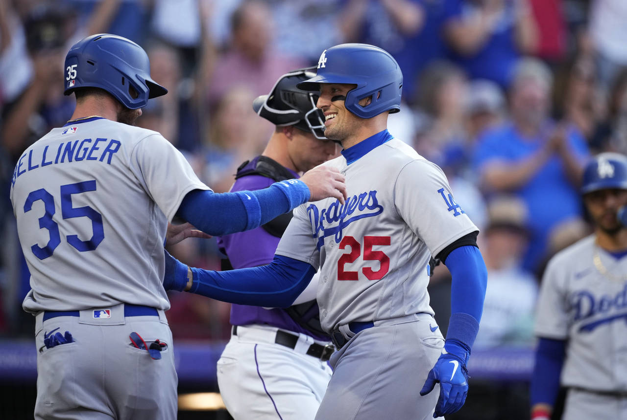 Los Angeles Dodgers' Cody Bellinger, left, congratulates Trayce Thompson, who hit a two-run home ru...