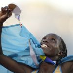 
              Gold medalist Norah Jeruto, of Kazakhstan, celebrates after her win in the women's 3000-meter steeplechase final at the World Athletics Championships on Wednesday, July 20, 2022, in Eugene, Ore. (AP Photo/Ashley Landis)
            