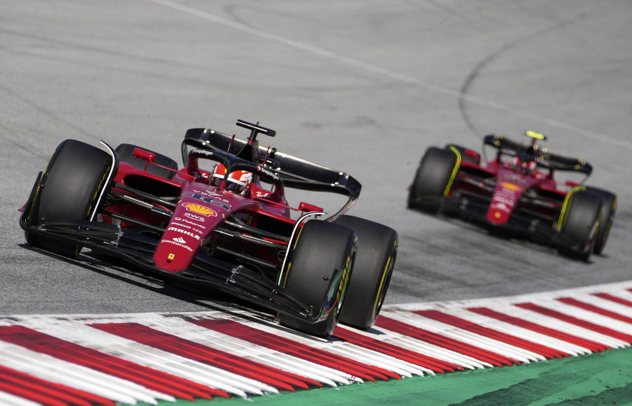 Ferrari driver Charles Leclerc of Monaco steers his car followed by Ferrari driver Carlos Sainz of ...