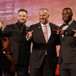 
              From left, North Carolina State's Devin Leary, coach Dave Doeren, Isaiah Moore and Drake Thomas pose for a photo onstage at the NCAA college football Atlantic Coast Conference Media Days in Charlotte, N.C., Wednesday, July 20, 2022. (AP Photo/Nell Redmond)
            