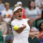 
              Romania's Simona Halep returns to Spain's Paula Badosa in a women's singles fourth round match on day eight of the Wimbledon tennis championships in London, Monday, July 4, 2022. (AP Photo/Alberto Pezzali)
            