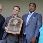 
              Hall of Fame baseball player Dave Winfield, second from right, stands next to inductee Bud Fowler's plaque held by Josh Rawitch, second from left, president of the National Baseball Hall of Fame and Museum, along with Rob Manfred, left, commissioner of Major League Baseball, and Jane Forbes Clark, right, chairman of the Board of Directors of The National Baseball Hall of Fame and Museum, during the Hall of Fame induction ceremony, Sunday, July 24, 2022, at the Clark Sports Center in Cooperstown, N.Y. (AP Photo/John Minchillo)
            