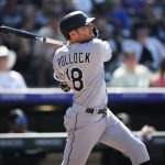 
              Chicago White Sox's AJ Pollock follows his two-run single off Colorado Rockies relief pitcher Carlos Estevez during the seventh inning of a baseball game Wednesday, July 27, 2022, in Denver. (AP Photo/David Zalubowski)
            