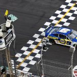 
              NASCAR Cup Series driver Chase Elliott (9) takes the checkered flag under a yellow caution flag at a NASCAR Cup Series auto race at Atlanta Motor Speedway in Hampton, Ga., Sunday, July 10, 2022. (AP Photo/Bob Andres)
            