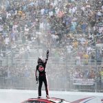 
              Christopher Bell celebrates after winning a NASCAR Cup Series auto race at the New Hampshire Motor Speedway, Sunday, July 17, 2022, in Loudon, N.H. (AP Photo/Charles Krupa)
            