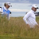 
              England's golfer Alex Wrigley gets supported by his wife Johanna Gustavsson during a practice round at the British Open golf championship in St Andrews, Scotland, Tuesday, July 12, 2022. The Open Championship returns to the home of golf on July 14-17, 2022, to celebrate the 150th edition of the sport's oldest championship, which dates to 1860 and was first played at St. Andrews in 1873. (AP Photo/Alastair Grant)
            