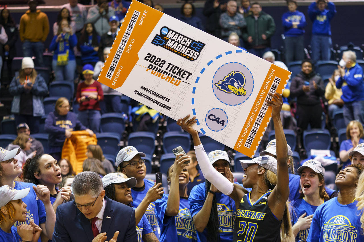 FILE - Delaware's Jasmine Dickey holds up the March Madness ticket following the second half of an ...