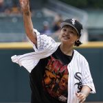 
              Singer King Marie throws out a ceremonial first pitch before a baseball game between the Cleveland Guardians and the Chicago White Sox in Chicago, Sunday, July 24, 2022. (AP Photo/Nam Y. Huh)
            