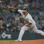 
              Oakland Athletics starting pitcher Frankie Montas throws against the Seattle Mariners during the first inning of a baseball game, Sunday, July 3, 2022, in Seattle. (AP Photo/Ted S. Warren)
            