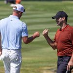 
              Tony Romo, right, fist bumps Mark Mulder after sinking the winning putt on the 18th hole during the final round of the American Century Celebrity Championship golf tournament at Edgewood Tahoe Golf Course in Stateline, Nev., Sunday, July 10, 2022. (AP Photo/Tom R. Smedes)
            