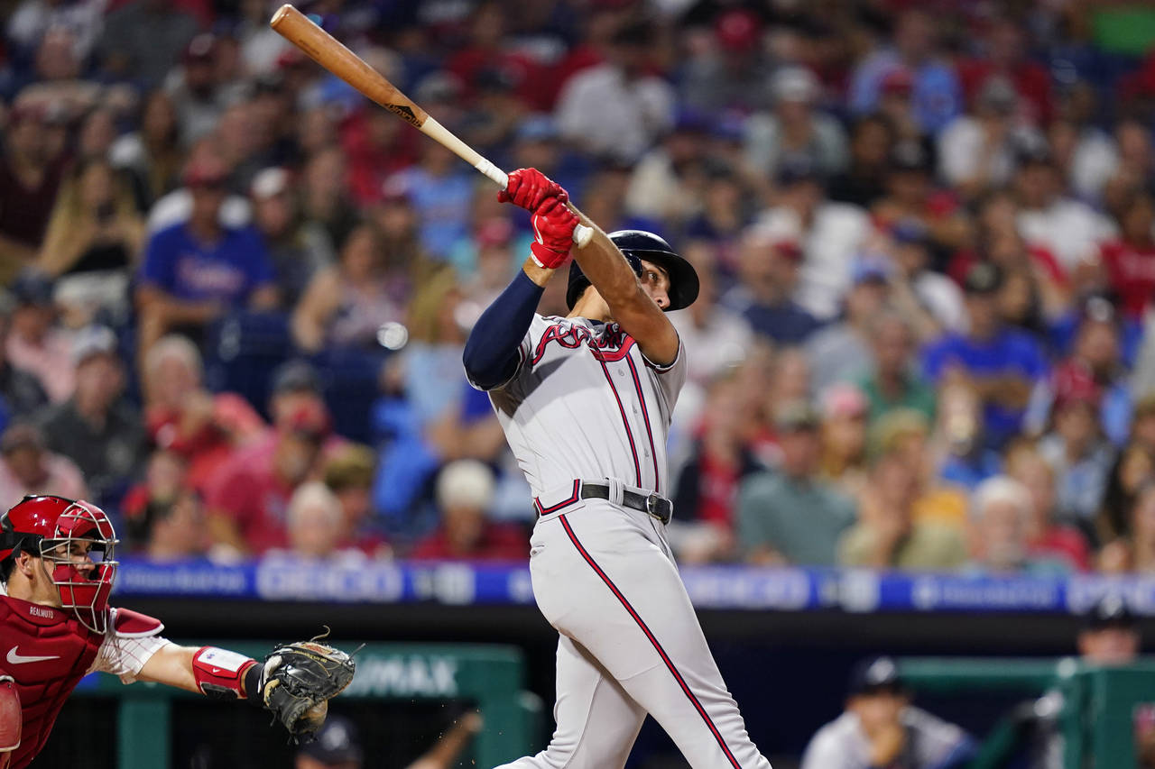 Atlanta Braves' Matt Olson hits a two-run home run against Philadelphia Phillies pitcher Aaron Nola...
