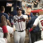 
              Atlanta Braves' Austin Riley returns to the dugout after scoring an RBI in the sixth inning of a baseball game against the St. Louis Cardinals Wednesday, July 6, 2022, in Atlanta. (AP Photo/Edward M. Pio Roda)
            