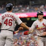 
              St. Louis Cardinals' Tommy Edman, right, is congratulated by Paul Goldschmidt after scoring on a wild pitch by Washington Nationals' Anibal Sanchez during the third inning of a baseball game Friday, July 29, 2022, in Washington. (AP Photo/Patrick Semansky)
            