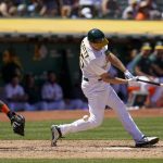 
              Oakland Athletics' Stephen Piscotty, right, strikes out against the Houston Astros to end the sixth inning of a baseball game in Oakland, Calif., Saturday, July 9, 2022. (AP Photo/Godofredo A. Vásquez)
            